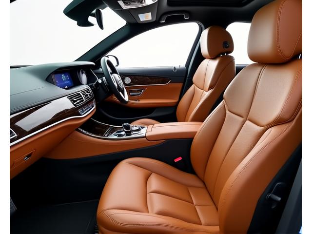 Luxury car interior being meticulously cleaned, showing deep conditioning of leather seats and clean dashboard